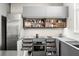 Efficiently designed kitchen with ample storage, gray cabinets, and modern appliances for a streamlined cooking experience at 855 3Rd N Ave, St Petersburg, FL 33701