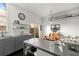 Modern kitchen with stainless steel island, gray cabinets, and open shelving at 855 3Rd N Ave, St Petersburg, FL 33701