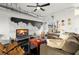 Comfortable living room featuring a large cloud artwork and modern industrial ductwork at 855 3Rd N Ave, St Petersburg, FL 33701