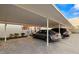 Covered parking area featuring brick pavers, white supports, and space for multiple vehicles at 855 3Rd N Ave, St Petersburg, FL 33701