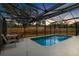 Inviting, screened-in pool area with patio furniture at 1317 Borden Ct, Valrico, FL 33594