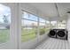 Laundry room with washer and dryer in a screened porch at 201 Bedford St # 79, Sun City Center, FL 33573