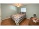 Bedroom with light walls, wood floors, and a ceiling fan at 215 Valencia Blvd # 105, Belleair Bluffs, FL 33770