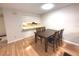 Dining area with a table and chairs, adjacent to the kitchen at 215 Valencia Blvd # 105, Belleair Bluffs, FL 33770