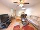 Living room features hardwood floors, comfortable seating and a view to the kitchen at 215 Valencia Blvd # 105, Belleair Bluffs, FL 33770
