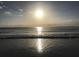Bright sunset reflecting on the ocean surface at 215 Valencia Blvd # 105, Belleair Bluffs, FL 33770