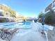 Inviting community pool with ample lounge chairs at 215 Valencia Blvd # 105, Belleair Bluffs, FL 33770