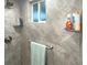 Shower with gray diagonal tiles and built-in shelves at 215 Valencia Blvd # 105, Belleair Bluffs, FL 33770