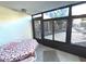 Bright sunroom features a table for dining and lovely views at 215 Valencia Blvd # 105, Belleair Bluffs, FL 33770