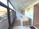 Relaxing sunroom offers ample seating and access to the outdoors at 215 Valencia Blvd # 105, Belleair Bluffs, FL 33770