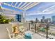 Stylish balcony with seating and a panoramic view of the city and waterfront at 226 5Th N Ave # 1502, St Petersburg, FL 33701