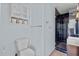 Modern bathroom featuring a blue-tiled shower, stylish toilet, and ample storage at 226 5Th N Ave # 1502, St Petersburg, FL 33701