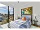 Bedroom with a large window offers beautiful city views, stylish furniture, and decor at 226 5Th N Ave # 1502, St Petersburg, FL 33701
