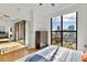 Bedroom boasts a large window with stunning city views and access to a private balcony at 226 5Th N Ave # 1502, St Petersburg, FL 33701