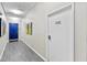Modern hallway with neutral walls and views of unit 1502 and colorful decor at 226 5Th N Ave # 1502, St Petersburg, FL 33701