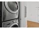 Modern laundry area with stainless steel, front-load washer and dryer at 226 5Th N Ave # 1502, St Petersburg, FL 33701
