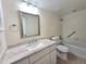 Updated bathroom featuring a granite vanity top, white cabinets, and a shower-tub combination at 3031 Countryside Blvd # 35C, Clearwater, FL 33761