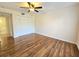 Bedroom featuring hardwood floors and ample closet space at 3031 Countryside Blvd # 35C, Clearwater, FL 33761