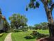 Scenic view of the lush golf course and manicured landscaping around the property with beautiful blue skies at 3031 Countryside Blvd # 35C, Clearwater, FL 33761