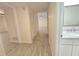 Hallway with closet and views into the bedrooms and bathroom at 3031 Countryside Blvd # 35C, Clearwater, FL 33761