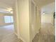 Hallway with closet and views into the bedrooms at 3031 Countryside Blvd # 35C, Clearwater, FL 33761