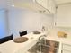 Kitchen featuring a stainless steel sink, ample counter space, and white cabinets, perfect for cooking and entertaining at 3031 Countryside Blvd # 35C, Clearwater, FL 33761