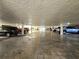Indoor parking garage with multiple parked vehicles, offering covered parking at 3031 Countryside Blvd # 35C, Clearwater, FL 33761