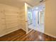 Walk-in closet with wire shelving that leads to bathroom with walk-in shower at 3031 Countryside Blvd # 35C, Clearwater, FL 33761