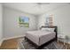 Bright bedroom with hardwood floors and a comfortable bed at 4150 Helena Ne St, St Petersburg, FL 33703