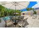 Inviting pool area with patio furniture and a large umbrella at 4150 Helena Ne St, St Petersburg, FL 33703