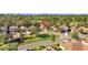 Single-Gathering home in a serene community with a tree-lined perimeter and golf course in the distance at 4275 Caskie Pl, Brooksville, FL 34604