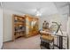 Bright bedroom with built-in bookcase, glass display case, and model house, offering ample storage at 4275 Caskie Pl, Brooksville, FL 34604