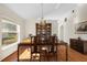 Formal dining area with hardwood floors, chandelier, and classic furniture at 4275 Caskie Pl, Brooksville, FL 34604
