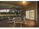 Covered screened lanai featuring tile flooring and furniture, perfect for outdoor entertaining at 4275 Caskie Pl, Brooksville, FL 34604