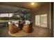 Relaxing screened lanai with comfortable seating and scenic golf course views at 4275 Caskie Pl, Brooksville, FL 34604