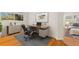 Bright office space with a large window, modern desk setup, and neutral decor, adjacent to the main bedroom at 4275 Caskie Pl, Brooksville, FL 34604