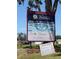Sign showcasing local businesses, including Westover's Flowers and the charming Mallie Kyla's Cafe at 4275 Caskie Pl, Brooksville, FL 34604