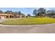 Neighborhood street view showing a grassy lot with curb appeal and a 'Stop' sign at 4275 Caskie Pl, Brooksville, FL 34604