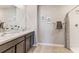 Double vanity bathroom with shower and modern finishes at 4477 Sand Dollar Way, Zephyrhills, FL 33541