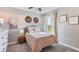 Charming bedroom with pink and white decor at 4477 Sand Dollar Way, Zephyrhills, FL 33541