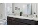 Bathroom with double vanity and a shower/tub combo at 4492 Sand Dollar Way, Zephyrhills, FL 33541