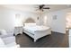 Main bedroom with a white bed frame and a nightstand at 7024 Blossom Ave, Tampa, FL 33614