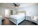 Main bedroom with king-size bed and direct access to bathroom at 7024 Blossom Ave, Tampa, FL 33614