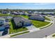 Home in a neighborhood with lake views, manicured lawns, and mature landscaping at 9152 Warm Springs Cir, Parrish, FL 34219
