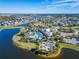 Panoramic aerial shot showcasing the community pool, lakes, and the well-designed layout of the homes at 9152 Warm Springs Cir, Parrish, FL 34219