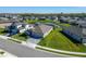 Aerial view of a home with lush landscaping and a serene pond, offering a private and tranquil setting at 9152 Warm Springs Cir, Parrish, FL 34219