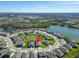 Aerial view of a home in a tranquil cul-de-sac, surrounded by serene ponds and lush landscaping at 9152 Warm Springs Cir, Parrish, FL 34219