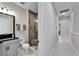 Modern bathroom features a glass enclosed shower, modern vanity and elegant tile flooring at 9152 Warm Springs Cir, Parrish, FL 34219