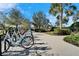 Community bicycles parked along a landscaped path, promoting an active and eco-friendly lifestyle at 9152 Warm Springs Cir, Parrish, FL 34219