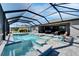 Outdoor living with sparkling pool, spa and screened enclosure connected to the home's patio at 9152 Warm Springs Cir, Parrish, FL 34219